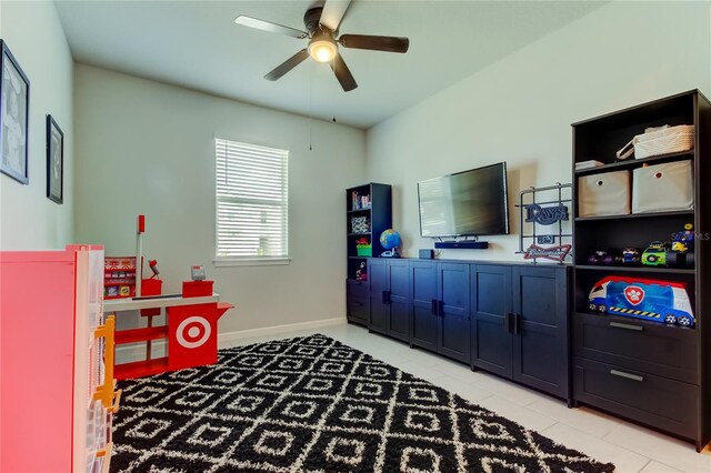 2456 Arbor Wind Dr, Lutz, FL 33558 - recreation room featuring ceiling fan, light tile patterned floors, and baseboards