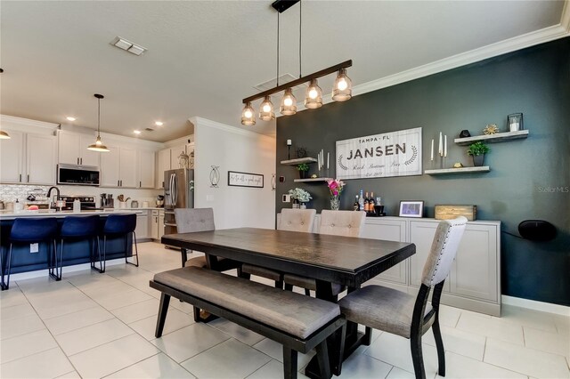 2456 Arbor Wind Dr, Lutz, FL 33558 - dining room with crown molding, light tile patterned flooring, recessed lighting, and baseboards
