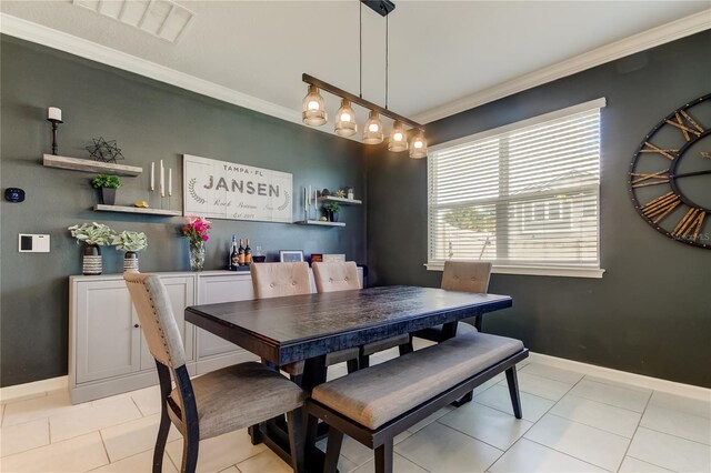 2456 Arbor Wind Dr, Lutz, FL 33558 - dining space featuring crown molding, light tile patterned floors, and baseboards