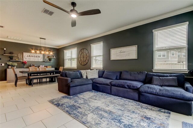 2456 Arbor Wind Dr, Lutz, FL 33558 - living area with ceiling fan, crown molding, and light tile patterned flooring