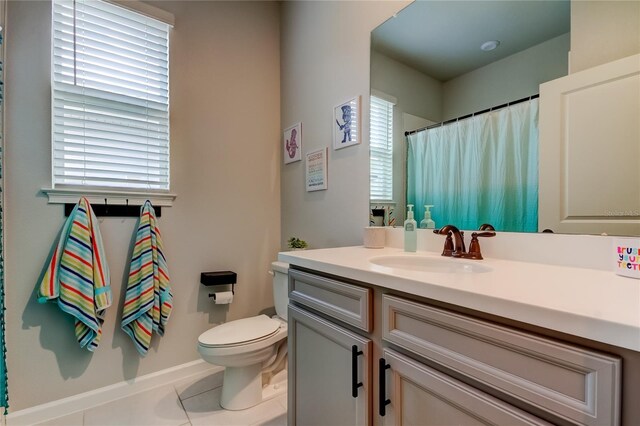 2456 Arbor Wind Dr, Lutz, FL 33558 - full bath featuring vanity, toilet, tile patterned floors, and healthy amount of natural light