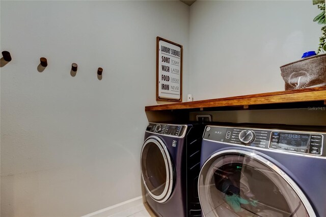 2456 Arbor Wind Dr, Lutz, FL 33558 - washroom featuring washing machine and dryer and baseboards
