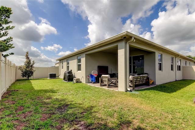 2456 Arbor Wind Dr, Lutz, FL 33558 - back of house featuring stucco siding, a patio, outdoor lounge area, and cooling unit