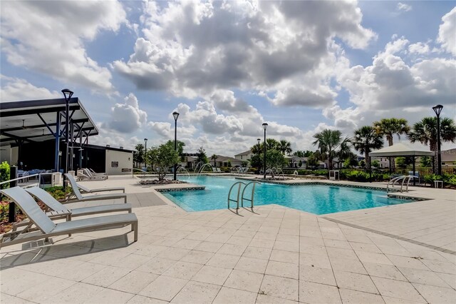 2456 Arbor Wind Dr, Lutz, FL 33558 - community pool featuring a patio area and a gazebo