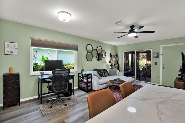 3229 40th Ln S Unit C, Saint Petersburg, FL 33711 - office space featuring wood finished floors, plenty of natural light, a ceiling fan, and baseboards