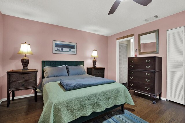 3229 40th Ln S Unit C, Saint Petersburg, FL 33711 - bedroom with dark wood-style floors, baseboards, and ceiling fan