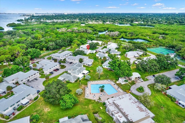 3229 40th Ln S Unit C, Saint Petersburg, FL 33711 - aerial view of property and surrounding area with a large body of water, a pool area, and nearby suburban area