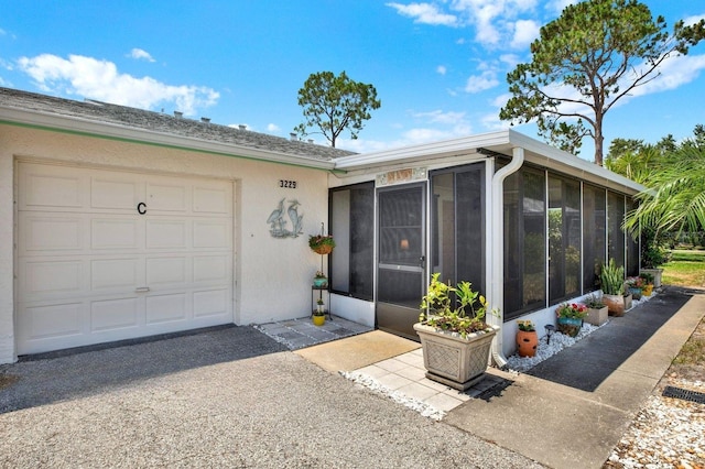 3229 40th Ln S Unit C, Saint Petersburg, FL 33711 - entrance to property featuring stucco siding and an attached garage