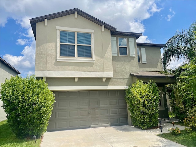 9520 Lemon Drop Loop, Sun City Center, FL 33573 - traditional-style home featuring stucco siding, concrete driveway, and a garage