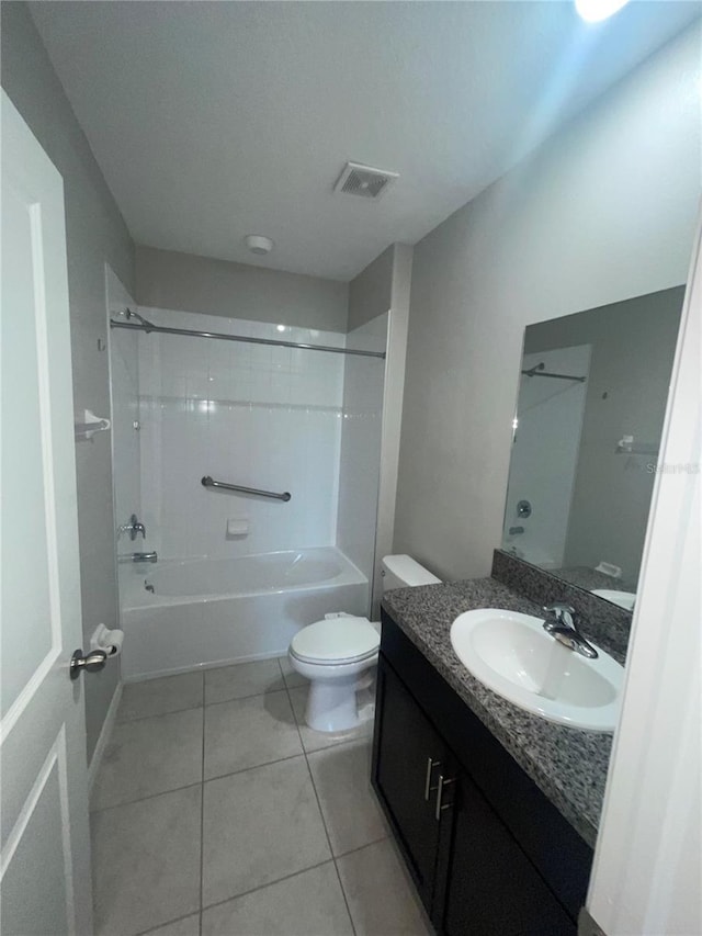 9520 Lemon Drop Loop, Sun City Center, FL 33573 - bathroom with vanity, toilet, tile patterned flooring, and washtub / shower combination