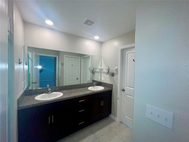 9520 Lemon Drop Loop, Sun City Center, FL 33573 - full bath with double vanity, tile patterned flooring, and recessed lighting