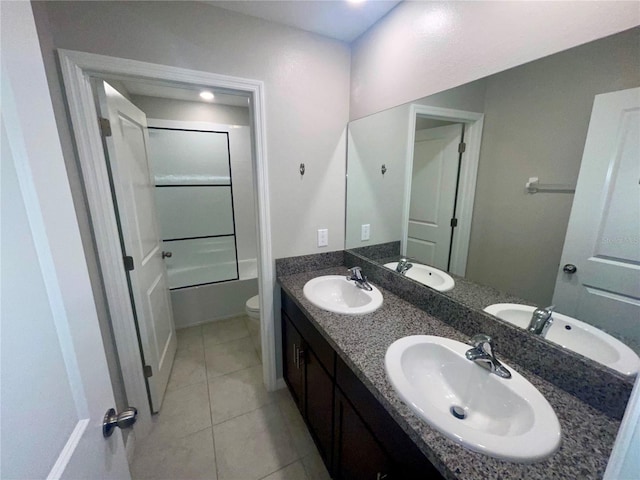 9520 Lemon Drop Loop, Sun City Center, FL 33573 - bathroom featuring toilet, double vanity, and tile patterned flooring