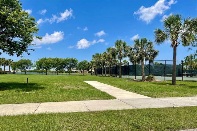 9520 Lemon Drop Loop, Sun City Center, FL 33573 - surrounding community featuring a tennis court