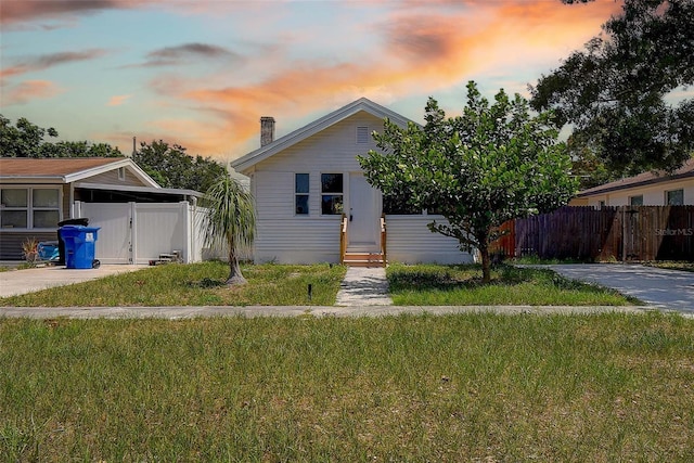 2627 17th Ave N, Saint Petersburg, FL 33713 - view of front of property with a chimney, concrete driveway, and entry steps