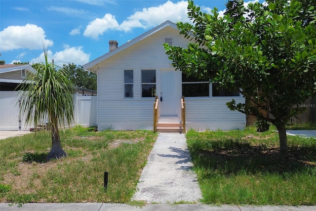 2627 17th Ave N, Saint Petersburg, FL 33713 - bungalow-style home with entry steps and a chimney