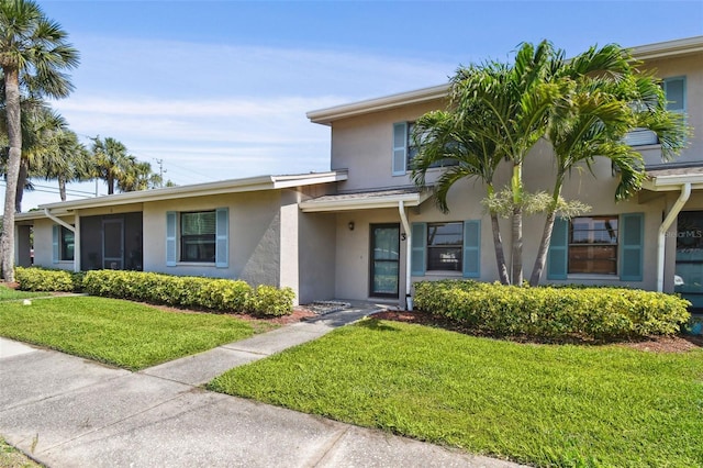 2131 Ridge Rd S Unit 3, Largo, FL 33778 - view of front of home with stucco siding and a front yard