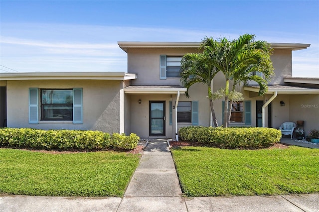 2131 Ridge Rd S Unit 3, Largo, FL 33778 - view of front facade with stucco siding and a front yard