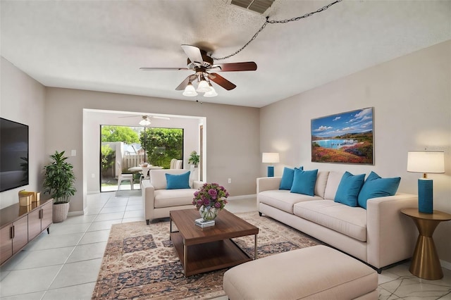 2131 Ridge Rd S Unit 3, Largo, FL 33778 - living area with ceiling fan, light tile patterned floors, and baseboards