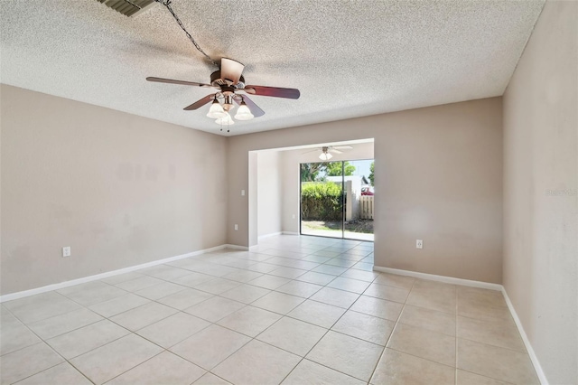 2131 Ridge Rd S Unit 3, Largo, FL 33778 - spare room featuring ceiling fan, a textured ceiling, light tile patterned floors, and baseboards