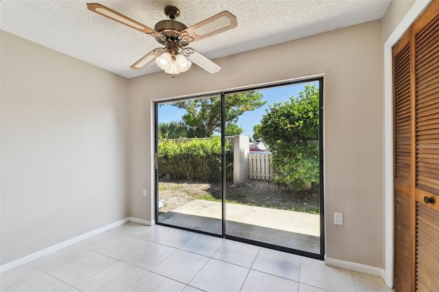 2131 Ridge Rd S Unit 3, Largo, FL 33778 - entryway featuring light tile patterned flooring, a textured ceiling, ceiling fan, and baseboards