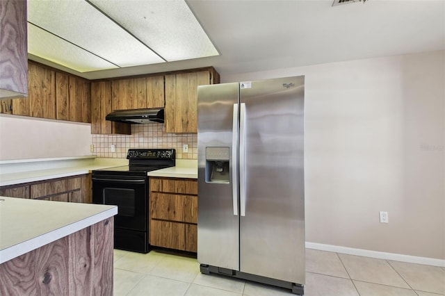 2131 Ridge Rd S Unit 3, Largo, FL 33778 - kitchen featuring stainless steel refrigerator with ice dispenser, black range with electric stovetop, under cabinet range hood, light countertops, and decorative backsplash