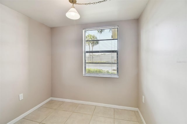 2131 Ridge Rd S Unit 3, Largo, FL 33778 - empty room featuring light tile patterned floors and baseboards