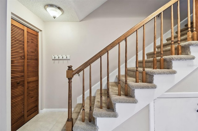 2131 Ridge Rd S Unit 3, Largo, FL 33778 - stairs with tile patterned flooring and a textured ceiling
