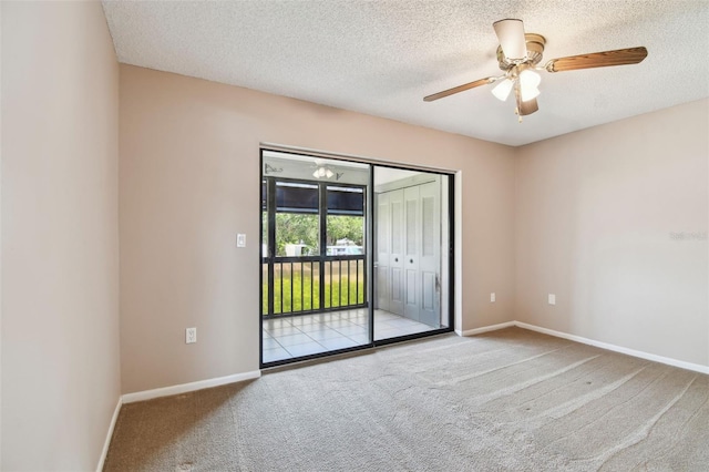 2131 Ridge Rd S Unit 3, Largo, FL 33778 - empty room featuring carpet, a textured ceiling, baseboards, and ceiling fan