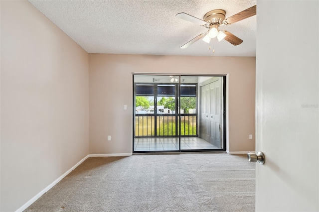 2131 Ridge Rd S Unit 3, Largo, FL 33778 - carpeted empty room with baseboards, a textured ceiling, and ceiling fan