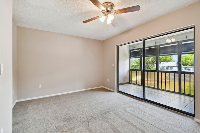 2131 Ridge Rd S Unit 3, Largo, FL 33778 - carpeted empty room with a textured ceiling, a ceiling fan, and baseboards