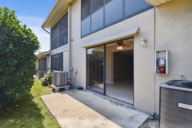 2131 Ridge Rd S Unit 3, Largo, FL 33778 - doorway to property featuring stucco siding, central air condition unit, and a patio