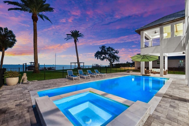 110 Carlyle Dr, Palm Harbor, FL 34683 - view of swimming pool with an in-ground hot tub, a patio area, a water view, and a ceiling fan