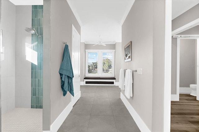 110 Carlyle Dr, Palm Harbor, FL 34683 - bathroom with a tile shower, tile patterned flooring, and ceiling fan