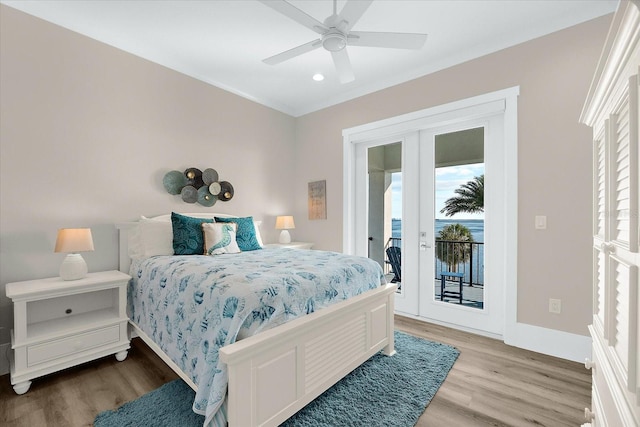 110 Carlyle Dr, Palm Harbor, FL 34683 - bedroom featuring access to exterior, multiple windows, light wood finished floors, and recessed lighting