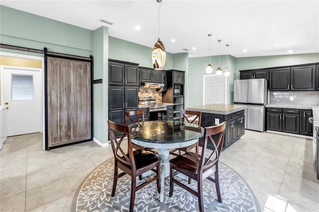 7461 Pescador Pl, Seminole, FL 33772 - dining area with light tile patterned flooring, a barn door, recessed lighting, and baseboards