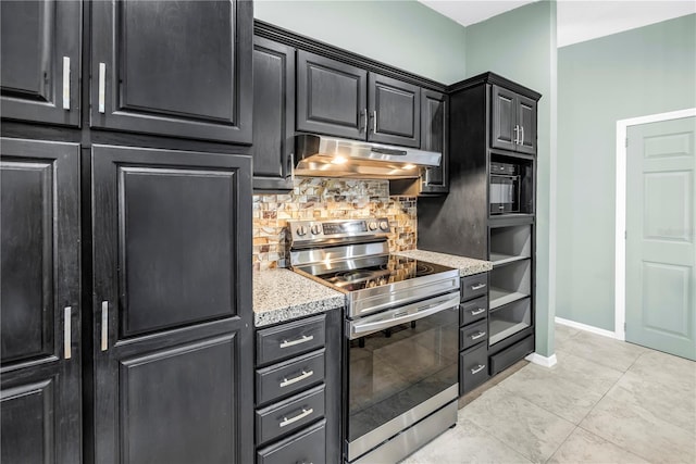 7461 Pescador Pl, Seminole, FL 33772 - kitchen featuring stainless steel electric range oven, under cabinet range hood, backsplash, baseboards, and dark cabinets