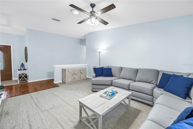 7461 Pescador Pl, Seminole, FL 33772 - living area featuring ceiling fan, carpet flooring, and baseboards
