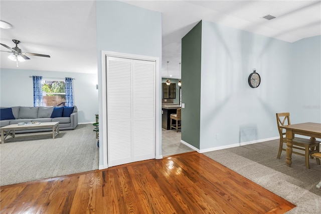 7461 Pescador Pl, Seminole, FL 33772 - dining room with ceiling fan, baseboards, wood finished floors, and carpet flooring