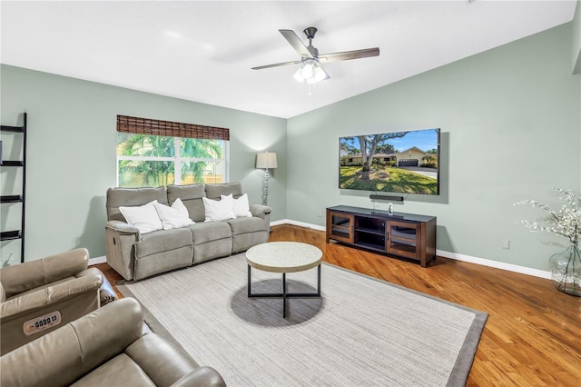 7461 Pescador Pl, Seminole, FL 33772 - living room with ceiling fan, wood finished floors, baseboards, and lofted ceiling
