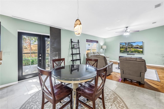 7461 Pescador Pl, Seminole, FL 33772 - dining room with baseboards, light tile patterned floors, and ceiling fan