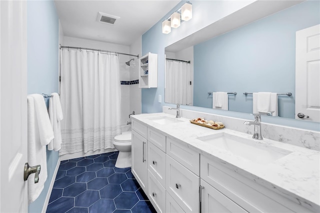 7461 Pescador Pl, Seminole, FL 33772 - full bathroom with double vanity, tile patterned floors, toilet, and shower / bath combo with shower curtain