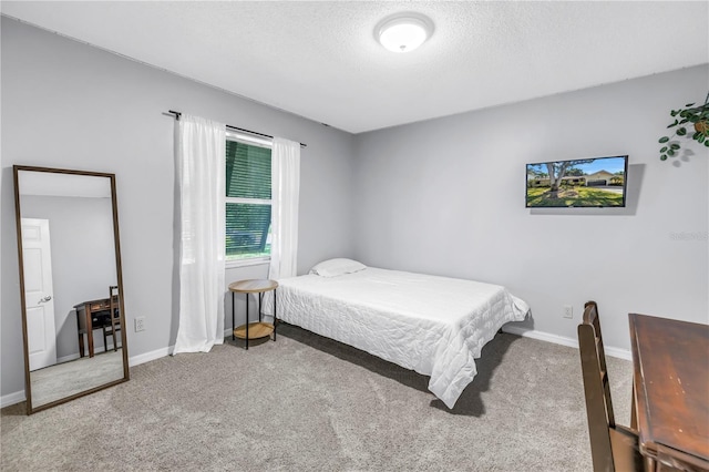 7461 Pescador Pl, Seminole, FL 33772 - bedroom featuring carpet floors, baseboards, and a textured ceiling