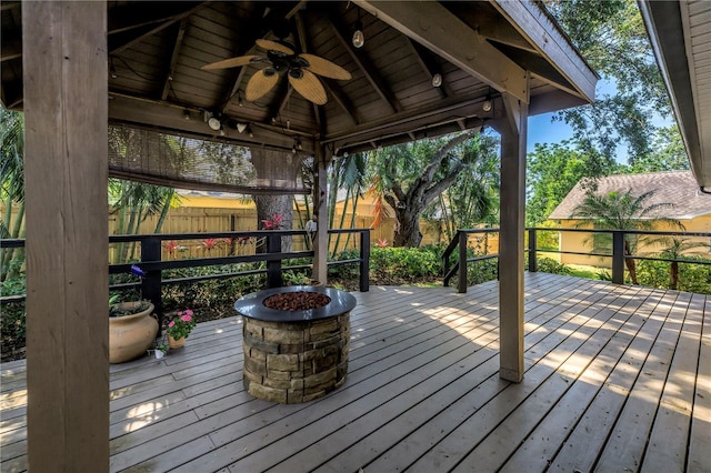 7461 Pescador Pl, Seminole, FL 33772 - wooden deck featuring a fire pit, a ceiling fan, and a gazebo