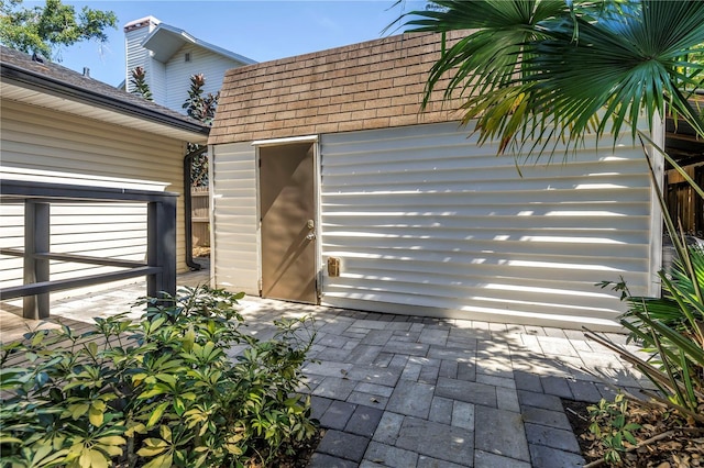 7461 Pescador Pl, Seminole, FL 33772 - property entrance with roof with shingles