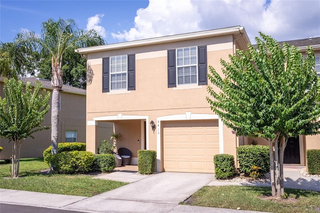 8415 Edgewater Place Blvd, Tampa, FL 33615 - view of front facade with an attached garage, stucco siding, and concrete driveway