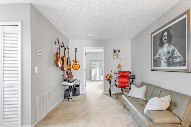 8415 Edgewater Place Blvd, Tampa, FL 33615 - living area with carpet, a textured ceiling, and baseboards