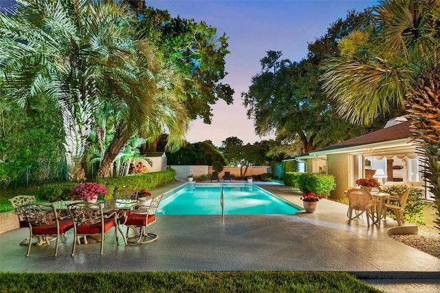 2110 Reaney Rd, Lakeland, FL 33803 - pool at dusk featuring a patio area