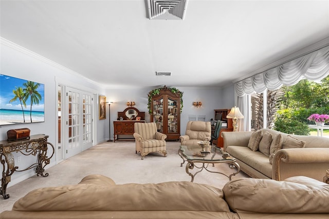 2110 Reaney Rd, Lakeland, FL 33803 - living area featuring french doors, light colored carpet, and ornamental molding