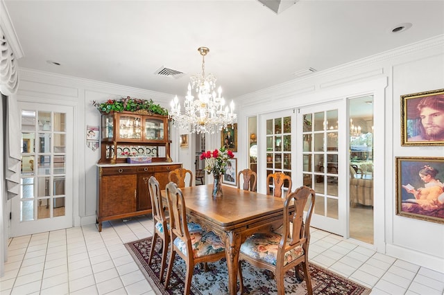 2110 Reaney Rd, Lakeland, FL 33803 - dining room with light tile patterned flooring, crown molding, a chandelier, and french doors