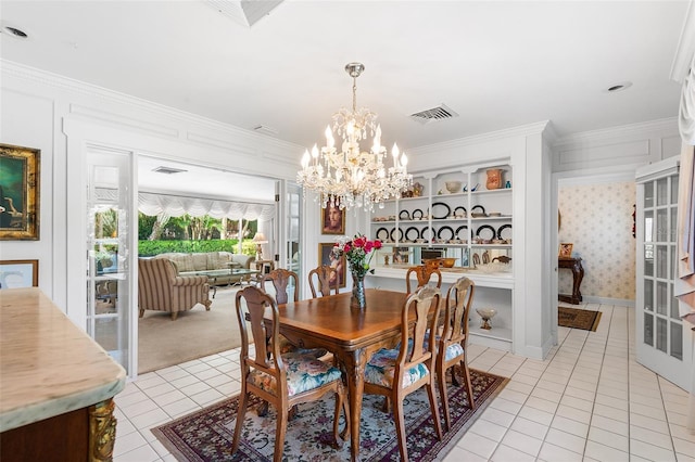 2110 Reaney Rd, Lakeland, FL 33803 - dining room with light tile patterned flooring, ornamental molding, a chandelier, and light colored carpet